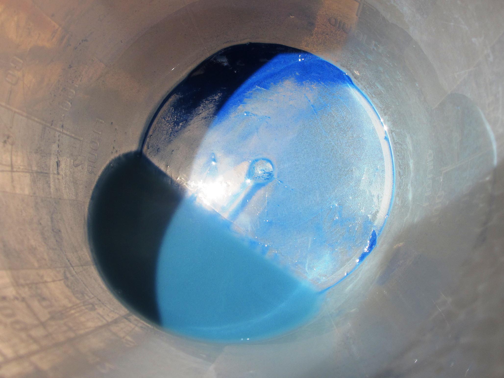 particles in the bottom of the jug